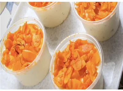 Four cups of sugar-free Pineapple Alaska dessert topped with pineapple pieces