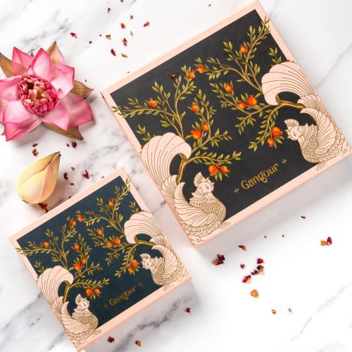 Gangour Anaar mithai gift boxes with traditional Indian art and floral design.