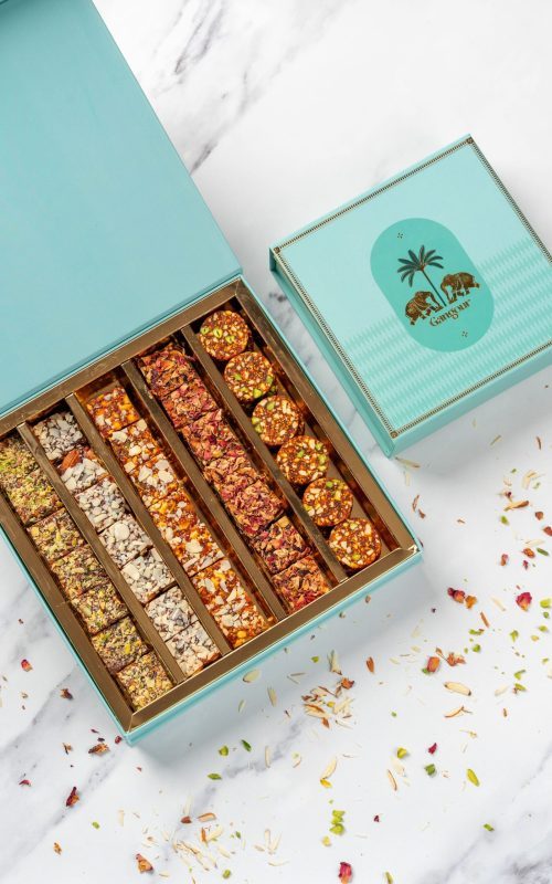 Turquoise Gangour Aranya mithai box with golden elephant and palm tree design