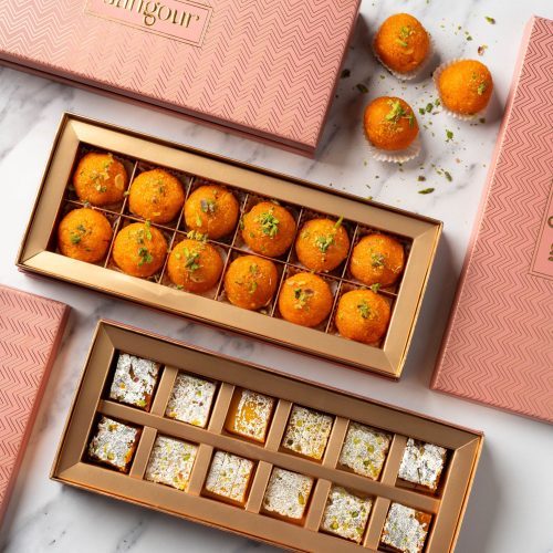 Elegant gift boxes with 12 motichoor laddoos and 12 pieces of barfi