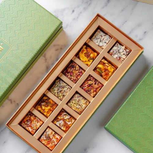 Box of 12 assorted sugar-free sweets arranged neatly in a green gift box